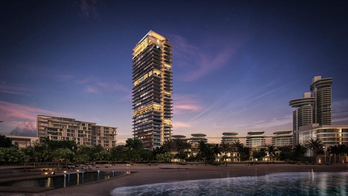 Rosewood Residences Dubai — illuminated tower above the waterfront at dusk