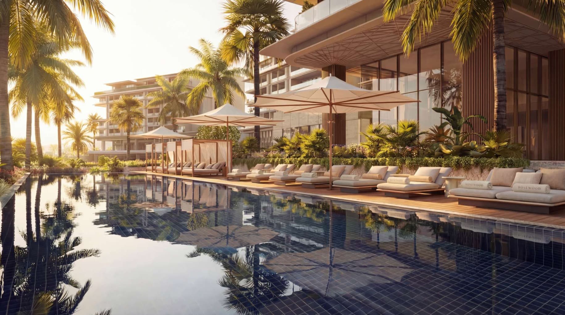 Rosewood residential pool, with palms and terraces in the late afternoon light